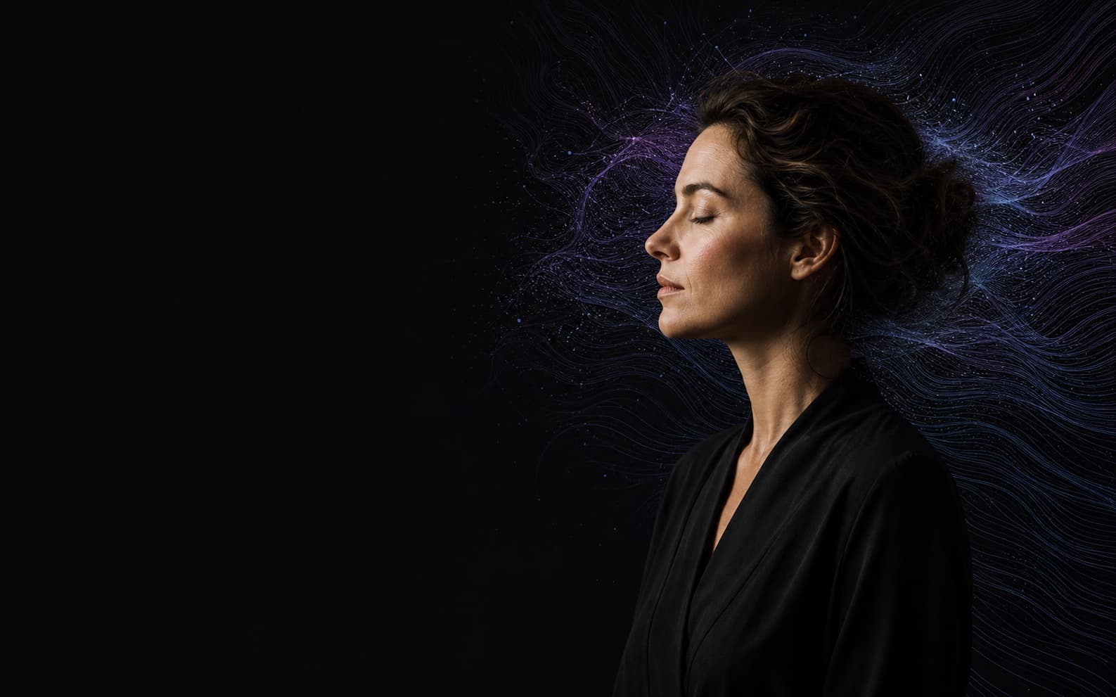 A thoughtful person surrounded by flowing abstract threads, representing human-centered intelligence